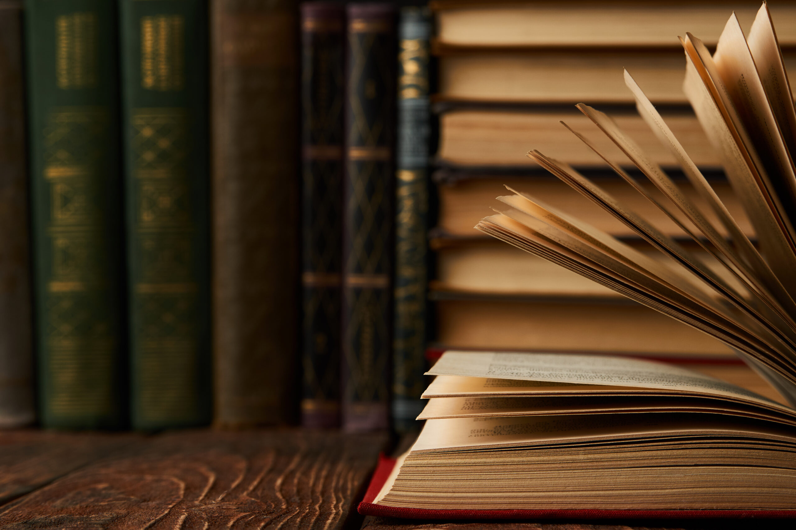 Stack of books on bookshelf, close-up. Education learning concep
